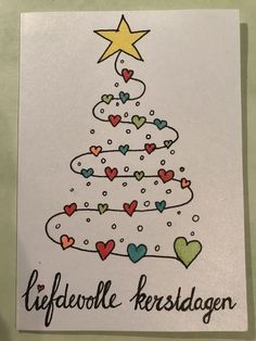 a card with a christmas tree and hearts on it that says lifelove kerstegeen