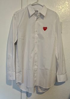 Brand new WOT  Size large CDG White Long Sleeve Shirt With Embroidered Logo, Classic Cotton Shirt With Embroidered Logo, Designer White Cotton Dress Shirt, Designer Button-up Shirt With Button Closure, Casual Long Sleeve Shirt With Embroidered Logo, Designer Cotton Button-up Dress Shirt, Classic Embroidered Button-up Shirt, Designer Cotton Button-up Shirt, Cdg Shirt