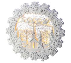 a snowflake with a church and trees in the background on a white surface