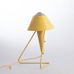 a yellow lamp with a cord attached to it