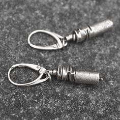 Handmade unique earrings - raw oxidized 925 sterling silver. Comfortable, perfect for everyday wear. Measurements: Total length - approx. 1.8 inches (4.5 cm) Sterling silver beads size - approx. 0.2 inch (6 mm) Sterling silver tube size - approx. 0.2 x 0.4 inch (6 x 10 mm) The earrings will be packaged in a jewellery box. If you have any questions please don't hesitate to contact me. Thank you! Everyday Oxidized Finish Dangle Earrings, Minimalist Oxidized Dangle Earrings, Gunmetal Earrings As Gift, Gunmetal Metal Earrings For Gift, Gunmetal Metal Earrings Gift, Unique Oxidized Everyday Earrings, Unique Oxidized Earrings For Everyday, Unique Oxidized Finish Everyday Earrings, Unique Everyday Earrings With Oxidized Finish