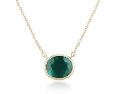 Introducing a captivating solitaire emerald necklace, adorned with a breathtaking 3.20-carat oval cut emerald. Set horizontally in a full bezel setting, the emerald showcases a deep, rich green color, with semi-transparent clarity and a delightful play of luster. Crafted in luxurious 14k gold, the necklace features a dainty cable chain that can be effortlessly adjusted from 18 to 16 inches in length, ensuring a perfect fit and adding a touch of versatility to this elegant piece. Setting Style: B Oval Emerald Pendant, May Emerald, Emerald Set, Oval Pendant Necklace, Emerald Style, Halo Necklace, Solitaire Necklaces, Emerald Pendant, Emerald Necklace