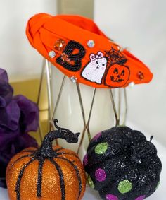 Introducing our Boo Halloween Knotted Headband, the spook-tacular hair candy that adds a festive touch to your Halloween look. This headband is specially designed to embrace the spirit of Halloween, featuring a delightful surprise in the word "Boo" - one "o" is a cute ghost crafted in seed beads, and the other "o" is a playful pumpkin also crafted in seed beads.
Crafted with attention to detail, our Boo Halloween Knotted Headband offers a unique and enchanting accessory to complete your Hallowee Ghost Crafts, Halloween Headband, Knotted Headband, Halloween Looks, Halloween Boo, Pumpkin Design, Cute Ghost, Knot Headband, A Pumpkin