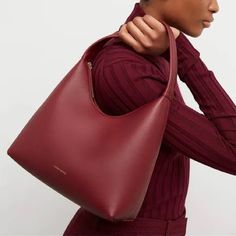 Mansur Gavriel Soft Candy Bag In Burgundy The Brand's Famed Candy Bag Has Been Softened Up (Think Ice Cream And Frosting) In Textured, Soft Calfskin Leather, Yet Remains The Sweet Style It Always Was. 10.5"W X 7"H X 4.5"D Top Zip Closure Shoulder Strap Interior Wall And Pocket Suede Lining Leather Made In Italy Retail $545 New W/Tag; Some Pressure Marks From Storage. Red Bag With Detachable Handle For Fall, Fall Red Bag With Detachable Handle, Classic Red Shoulder Bag For Fall, Burgundy Soft Leather Bag, Red Office Bag For Fall, Red Double Handle Shoulder Bag For Work, Burgundy Bags With Removable Pouch, Classic Red Bags For Fall, Burgundy Bags For Everyday Use In Fall