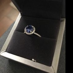 an open box with a ring in it