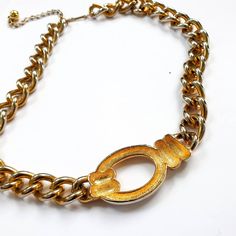 "A beautiful gold chain choker , Great Gift Idea Condition: Great vintage condition Measurements: total Length : 19.7\" / 50 cm We Offer: * Worldwide Shipping * Free Tracking Number * Free Gift Wrapping * Helpful Customer Service ---------------- * ALL ITEMS https://www.etsy.com/shop/VintageNr5 * Every garment we sell is authentic vintage and one-of-a-kind! You will receive the exact item photographed. * For sales and promotions, follow us @vintagenr5 * Subscribe email list and be the first to k Vintage Gold Chain Necklace For Gift, Vintage Gold Necklace With Adjustable Chain, Retro Gold Jewelry With Adjustable Chain, Vintage Gold Plated Necklace With Adjustable Chain, Retro Gold Necklace As A Gift, Retro Gold Necklace For Gift, Vintage Gold Metal Chain Necklace, Vintage Style Chunky Chain Necklace As Gift, Retro Gold Necklace With Adjustable Chain