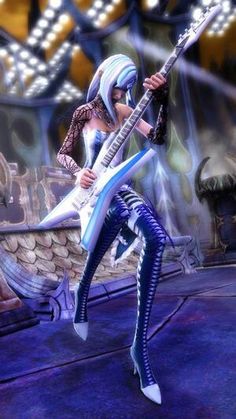 a woman with white hair and blue makeup playing an electric guitar in front of a stage