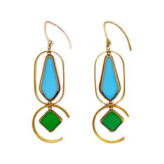 Glass Bead Earrings - These earrings, lightweight and designed to rotate and reposition with movement, are composed of blue and green vintage German glass beads that were hand-pressed between during the period between the 1920s and 1960s, edged with 24k gold. The metal frames are 24k gold-plated over brass and have been coated for anti-tarnish. The ear wires are gold-filled. Each piece will vary slightly. Retro Blue Drop Earrings Jewelry, Retro Blue Drop Earrings, Retro Blue Earrings For Pierced Ears, Retro Green Drop Earrings, Retro Green Enamel Jewelry, Retro Teardrop Earrings, Art Deco Blue Drop Earrings, Blue Art Deco Drop Earrings, Vintage Blue Brass Earrings