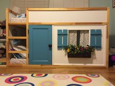 a child's room with a bunk bed and blue doors