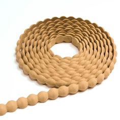 a close up of a rope on a white background with a circular hole in the middle