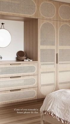 the bedroom is decorated in white and wood with wicker accents on the doors, drawers, and bedding