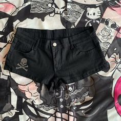 These trendy low-rise denim shorts feature a unique rhinestone skeleton embellishment, making them a standout piece in your wardrobe. Perfect for adding a touch of edginess to any outfit, these shorts are both stylish and eye-catching.  **Options:** 1. One pair of shorts without a leg loop. 2. One pair of shorts with a leg loop.      	 		 			Size 			S 			M 			L 		 		 			Waist 			71 			75 			79 		 		 			Hips 			88 			92 			96 		 		 			Length 			27 			28 			29 Skull Print Cotton Bottoms For Streetwear, Punk Style Jean Shorts For Streetwear, Trendy Shorts For Alternative Fashion, Trendy Shorts For Summer Alternative Fashion, Trendy Summer Shorts For Alternative Fashion, Fitted Punk Bottoms With Skull Print, Edgy Cotton Shorts For Streetwear, Punk Streetwear Shorts, Punk Style Streetwear Shorts