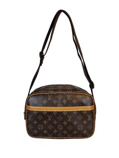 Louis Vuitton "Reporter PM" shoulder bag is compact yet has excellent storage capacity. It is lightweight and can be used as a shoulder tote, for daily use, travel or a business bag. 2 main compartments with zipper closing, one slip in pocket on the front and one slip in pocket inside. Overall a good condition, slightly out of shape. Shows patina and stain on the leather. Corners shows some rubbing. Hardware has some metal peeling and minor scratches. Interior shows sign of use with some minor d Pm Monogram, Gold Ounce, North Korean, Out Of Shape, Business Bag, Shoulder Tote, A Business, Inside Pocket, Louis Vuitton Monogram