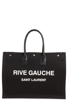 Perfect for days when you're toting a lot but still want to look Left Bank-chic, this spacious canvas tote features rolled leather handles and a bold logo. Style Name:Saint Laurent Noe Rive Gauche Logo Canvas Tote. Style Number: 6084311. Canvas Shoulder Bag With Logo For Errands, Chic Canvas Shoulder Bag With Logo, Logo Tote Canvas Bag For Errands, Designer Large Capacity Canvas Bag, Canvas Logo Bags For Errands, Black Canvas Shopping Bag With Logo, Chic Canvas Bags With Logo, Coated Canvas Bag With Logo For Shopping, Coated Canvas Shopping Bag With Logo