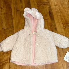 Light Pink Two Buttons Very Warm And Comfy Cute White Outerwear With Fleece Lining, Cute Cream Winter Outerwear, Cute Cream Outerwear, Cute Warm White Outerwear, Winter Long Sleeve Outerwear For Playtime, Cute Cream Long Sleeve Outerwear, Casual Warm Outerwear For Playtime, Cute Pink Fleece Outerwear, Hooded Outerwear With Fleece Lining For Playtime