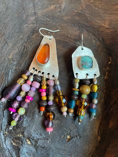 These colorful, gorgeous, soulful, handmade earrings feature focal stones, amber and turquoise, set in a handmade sterling silver bezel, with glass, wooden, and vintage beads. These one of a kind earrings are made for the bohemian soul! Artisan Beaded Dangle Earrings With Natural Stones, Artisan Dangle Beaded Earrings With Natural Stones, Artisan Natural Stone Beaded Dangle Earrings, Artisan Natural Stone Dangle Beaded Earrings, Bohemian Amber Drop Earrings, Artisan Earrings With Natural Stones For Festivals, Unique Beaded Drop Earrings With Natural Stones, Bohemian Sterling Silver Earrings With Natural Stones, Bohemian Sterling Silver Beaded Earrings For Jewelry Making