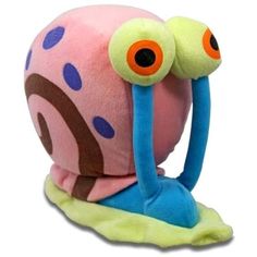 a close up of a stuffed animal with big eyes and a worm on it's back