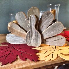 some wooden leaves are sitting on a table