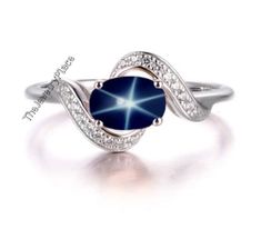 This Ring Features a 7X5 MM Oval Cabochon Natural Lindy Star and Sterling Silver Finished with rhodium. Customization is available. It is made by hand, and it will take about 3 to 5 business days to finish the ring after your payment is completed. Product Details Main Stone: Natural Blue Lindy Star Metal Type: 92.5 Sterling Silver finished with rhodium Accent stone : Zircon How To take care of This Ring - Keep the jewelry away from direct heat, water, perfumes, deodorants, and other strong chemi Silver Star-shaped Gemstone Ring, Silver Star-shaped Ring With Gemstone, Star-shaped Sterling Silver Sapphire Ring, Star-shaped Silver Sapphire Promise Ring, Sterling Silver Star-shaped Sapphire Ring, Star-shaped Silver Sapphire Ring, Star-shaped Sapphire Ring As Gift, Star-shaped Sapphire Ring For Gift, Silver Star-shaped Sapphire Ring As Gift