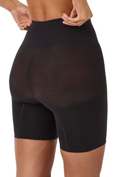 Feel supported in these shaping shorts made with seamless knitting that targets your core for a smooth look that's invisible under clothes. Lined gusset 55% nylon, 45% elastane Machine wash, tumble dry Imported Compressive Smoothing Shorts, Stretch Black Boxer Briefs With Built-in Shorts, Black Stretch Boxer Briefs With Built-in Shorts, Black Seamless Micro-elastic Hosiery, Fitted Elastane Shorts With Smoothing Details, Black Seamless Short Length Boxer Briefs, Fitted Shapewear Boxer Briefs Short Length, Fitted Shapewear Boxer Briefs, Fitted Shapewear Style Boxer Briefs