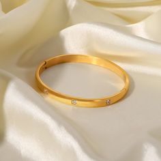 Elevate your style with the Crystal Bangle Bracelet. This stunning piece features brilliant crystals on an 18k gold-plated bangle, offering both glamour and sophistication. Bangle Design, The Bangles, Woman Jewelry, Gemstone Bangle, Stone Bangle, Crystal Bangle, Stainless Steel Bangles, Simple Bracelets, Anniversary Jewelry