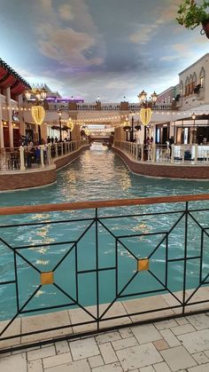 the inside of a shopping mall with water in it