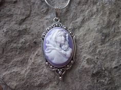 "Beautiful Virgin Mary cradling baby Jesus cameo necklaces I can make matching earrings, brooch and a bracelet also, so please feel free to message me, and I will set up a custom/reserved listing. The cameos are gorgeous, choose from purple blue or pink I do have other colors and styles, so please do browse, I can make any cameo in my shop into this pretty necklace, so browse and message me with a custom order The pretty setting is about 1 1/2\" long, please do see the photo The chain is a 22\" Cute Handmade Jewelry For Mother's Day, Blue Cameo Jewelry Gift, Sterling Silver Cameo Jewelry For Gift, Cute Handmade Jewelry For Christmas, Cute Handmade Christmas Jewelry, Handmade Cute Jewelry As Gift For Mom, Cute Handmade Jewelry As Gift For Mom, Personalized Jewelry For Mother's Day Collectible, Cameo Jewelry Gift