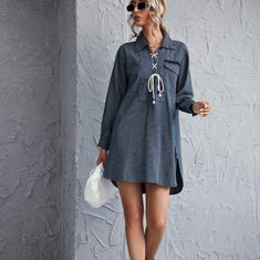 Modern Lace Up Striped Dress With Curved Hem. Denim Blue. V-neck Denim Blue Dress For Beach, Chic Denim Dress For The Beach, Chic Denim Beach Dress, Long Sleeve Dark Wash Mini Dress For Summer, Chic Mini-length Denim Dress For Vacation, Spring Beach Mini Dress In Denim Blue, Casual Denim Mini Dress For Vacation, Chic Denim Mini Dress For Beach, Spring Blue Denim Dress For Day Out