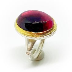 "Extraordinary Sterling silver and 18K Gold ring (bezel) with a beautiful 18,4 mm x 13,6 mm (12,05 carats) oval bicolour Tourmaline cabochon. High quality handmade 18K Gold and Sterling silver ring. Ring size: 6 1/2, DE: 53 (16,8 mm). ESP: 13, UK: N, FR: 53, IT: 13. If it's not the required size, maybe we can adapt to. Please ask for. Also we can make an order custom ring for you. Delivery time a week plus shipment. If you need more information about the dimensions or more images to improve the Oval Hallmarked Dome Ring As Gift, Oval Hallmarked Dome Ring Gift, Oval Cabochon Dome Ring With Polished Finish As Gift, Modern Silver Ruby Ring With Oval Shape, Gift Dome Ring With Oval Cabochon And Polished Finish, Handmade Oval Ruby Ring For Formal Occasions, Oval Dome Ring With Bezel Setting As Gift, Oval Dome Ring With Bezel Setting For Gift, Oval Dome Ring With Bezel Setting