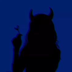 the silhouette of a woman with horns on her head holding a toothbrush in her hand