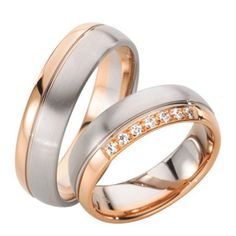 two gold and silver wedding rings with diamonds