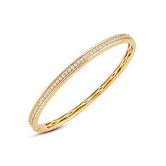 There's power in sparkle. Add this classic bangle to your office ensemble and seal a deal in style. The openable rigid bracelet in yellow gold features a classic diamond pave running along half of the bangle's circumference. This chic piece can easily be paired with almost any of your outfits. Classic Single Cut Diamond Cuff Bangle Bracelet, Classic Cuff Bracelet With Diamond Accents, Classic Single Cut Diamond Cuff Bangle, Classic Yellow Gold Bracelet With Channel Set, Classic Yellow Gold Bracelets Channel Set, Classic Yellow Gold Bracelet Channel Set, Timeless Yellow Gold Bangle With Pave Setting, Luxury Channel Set Diamond Bangle Bracelet, Classic Diamond Pave Bangle Bracelet