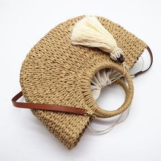 Our Xanthippe Half Moon Bag will inspire you right away with its half-moon shape, its roundness, and its exotism. The rounded carrying handles like the sun embodies the softness and light-heartedness of summer. The braided material gives it an incomparable charm. Specs: Material: Straw Bohemian Tote Bag For Summer Outings, Beige Bohemian Beach Bag For Summer Outings, Bohemian Shoulder Bag With Bamboo Handle For Summer, Bohemian Beach Bag With Braided Handles For Summer Outings, Bohemian Beige Bags For Summer Outings, Beige Straw Bag With Round Handle For Vacation, Trendy Beach Bag With Round Handle For Vacation, Natural Bags With Braided Handles For Summer Outings, Bohemian Summer Bag With Bamboo Handle