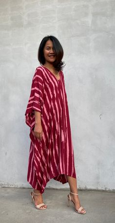 Indulge in the beauty of our classic kaftan with hand silk-screen printed fabric. This kaftan dress boasts unique patterns on high-quality rayon fabric. Its versatile design allows you to create many stylish looks, ensuring you always feel your best, whether you're at home or stepping out. Red V-neck Free Size Kaftan, Festival V-neck Kaftan With Block Print, Oversized Red Bohemian Dress, Printed Flowy Traditional Kaftan, Festival Block Print V-neck Kaftan, Traditional Flowy Printed Kaftan, Flowy Pink Printed Kaftan, Festival V-neck Block Print Kaftan, Red Bohemian Flowy Kaftan