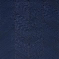 an image of a chevroned wallpaper pattern in dark blue tones with white lines