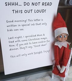 an elf is standing next to a sign that says shh do not read this out loud