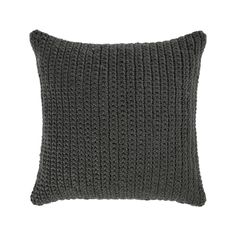 a gray knitted pillow on a white background