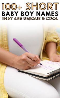 a person writing on a notebook with the words, 100 + short baby boy names that are unique and cool