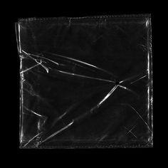 an empty black plastic bag on a black background