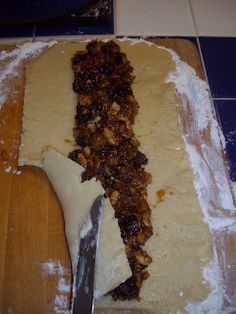 a knife and some food on a cutting board