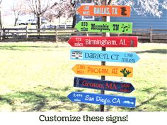 a wooden sign with many different colored signs on it