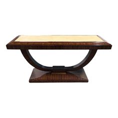 a wooden table with a glass top and base on it's end section, against a white background