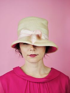 This hat would be perfect for a summer wedding or derby! Such a cute accessory. The straw like exterior is really elevated with the pink under the brim - the perfect pop of color! Tag says "Fashion Guild". FREE SHIPPING Measurements: Circumference for head: 21 inches Height: about 5 inches Good vintage condition - The ribbon is ever so slightly frayed at the edges with a few minor spots on the straw. See photos. Minor bends from prior storage to the piece, but sets well on the head. Please note: Straw Sun Hat, 1960s Fashion, Color Tag, Dress Form, Sun Hat, Straw Hat, Hat Designs, The Pink, Tissue Paper