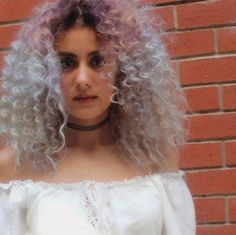 @sumeyyeummah is breaking our hearts with her #ethereal #beauty... She looks like a Goddess with her #pastel #curly tendrils blowing in the breeze. For this delightful look, she used our #BlueSteel and #LieLocks over bleached hair. For a very light shade like this, we recommend mixing each color with #Pastelizer before using. Lavender Hair, A Goddess, Bleached Hair, Light Shade, Ethereal Beauty