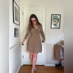 This is a gorgeous 90s does 70s faux wrap dress. Made of a brown and green stretchy fabric that has funky geometric circles and triangles all over it. the dress has a slight collar and belt loops but no belt. Has no size tag, but has quite a bit of stretch - see measurements in photos for best fit - approx a small. Brand is Donutz inc. very office siren aesthetic! Brown Fitted V-neck Wrap Dress, Brown Fitted Dress With Surplice Neckline, Retro Fitted Brown Mini Dress, Fitted Mini Wrap Dress For Fall, Fitted Mini Length Wrap Dress For Fall, Retro Fitted Belted Dresses, Fitted Retro Belted Dress, Fitted Belted Wrap Dress For Date Night, Fitted Brown V-neck Wrap Dress