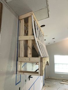 an unfinished staircase is being built in the corner of a room