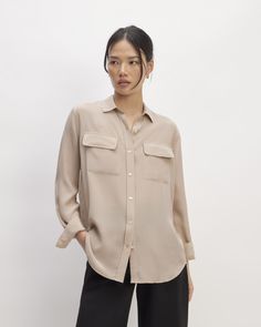 Just add pockets. About as effortless as a silk shirt gets, we took our best-selling Relaxed Silk Shirt silhouette and added pockets. The Washable Clean Silk Two-Pocket Relaxed Shirt features a traditional point collar, round hem, and two utility pockets. Plus, it’s made of our eco-conscious Clean Silk, for more beauty and less waste. Milled at a GOTS-certified facility, dyed at a bluesign®-certified dyehouse, and made at a LEED-certified factory, our Clean Silk is free of harmful chemicals Classic Button-up Blouse With Welt Pockets, Elegant Tops With Pockets And Shirttail Hem, Workwear Shirt With Welt Pockets And Shirttail Hem, Classic Collared Blouse With Buttoned Pockets, Everyday Blouse With Pockets And Spread Collar, Classic Workwear Blouse With Buttoned Pockets, Classic Blouse With Buttoned Pockets For Work, Effortless Blouse With Pockets In Relaxed Fit, Effortless Relaxed Fit Blouse With Pockets