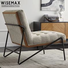 a chair sitting on top of a rug next to a dresser