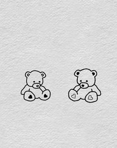 two teddy bears sitting next to each other on a white paper background with black ink