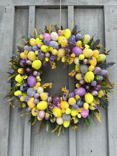 an easter wreath is hanging on the door